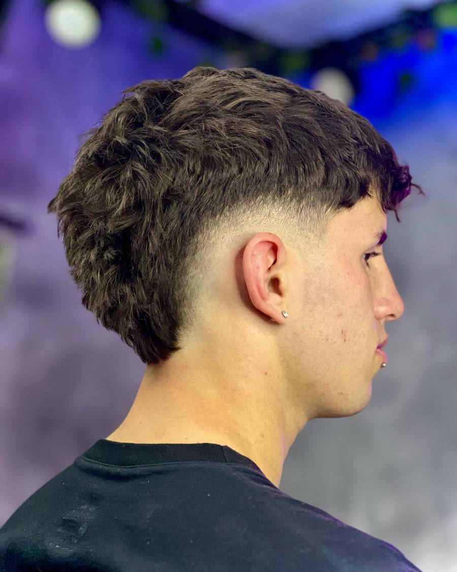 a photo of men in a back side with fade haircut