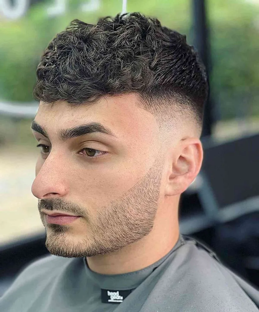 Curly hair mid taper textured fringe style with volume and defined curls