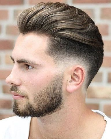 Side view of a comb over burst fade haircut with hard part