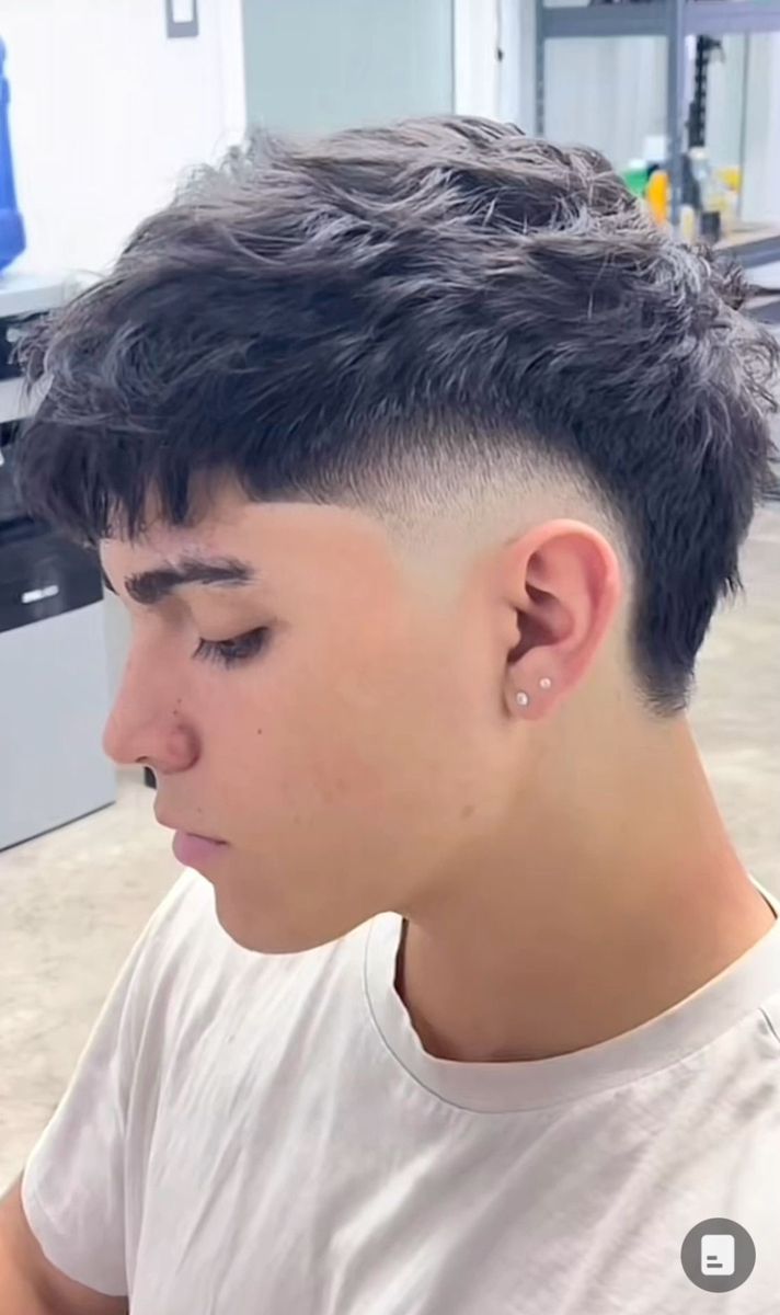 he burst fade mullet for short hair keeps the back shorter than traditional mullets