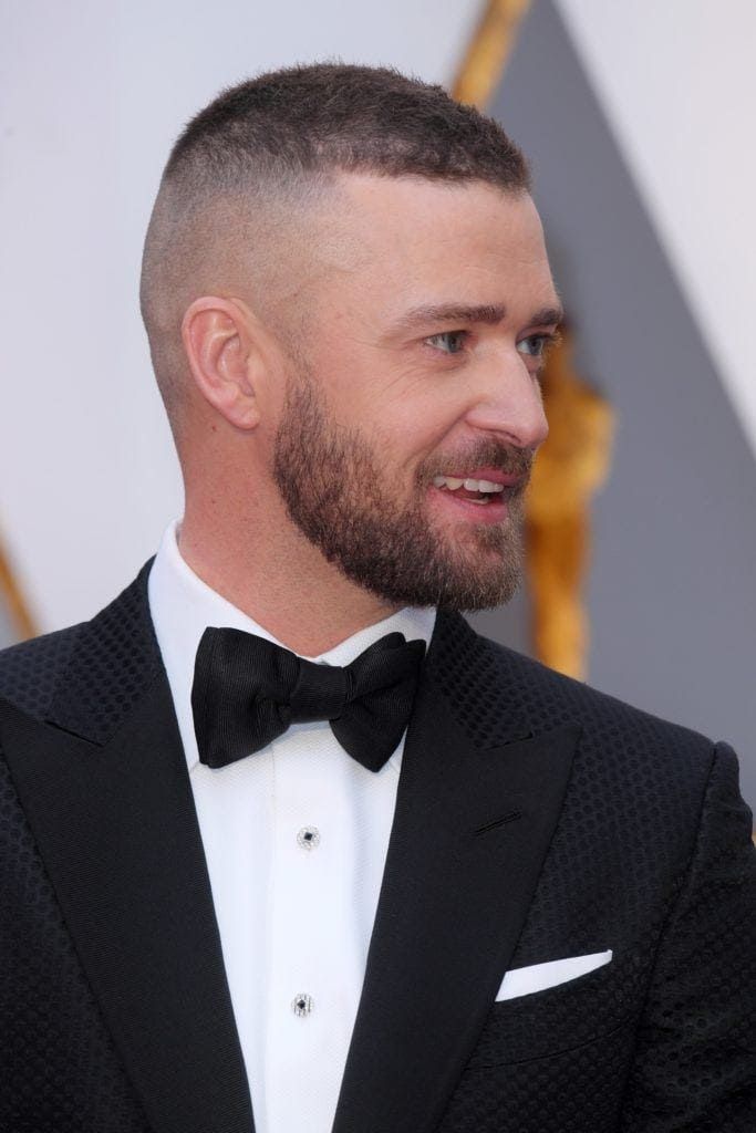 Close-up of number 0.5 and number 1 clipper guards used for a Justin Timberlake buzz cut, essential tools for a DIY short haircut.