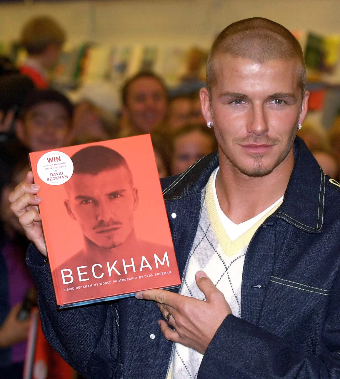 Man with fade buzz cut, a modern David Beckham-inspired men’s short hairstyle with tapered sides.