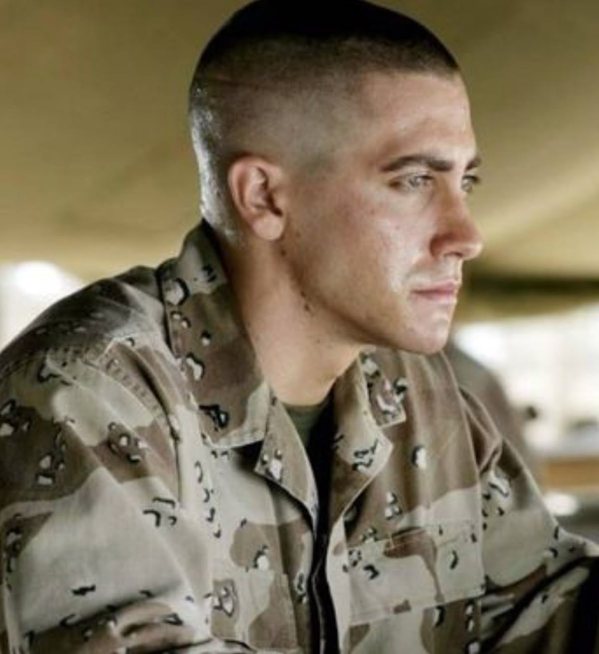 "Brad Pitt in Fury movie with military buzz haircut" (historical/film reference).