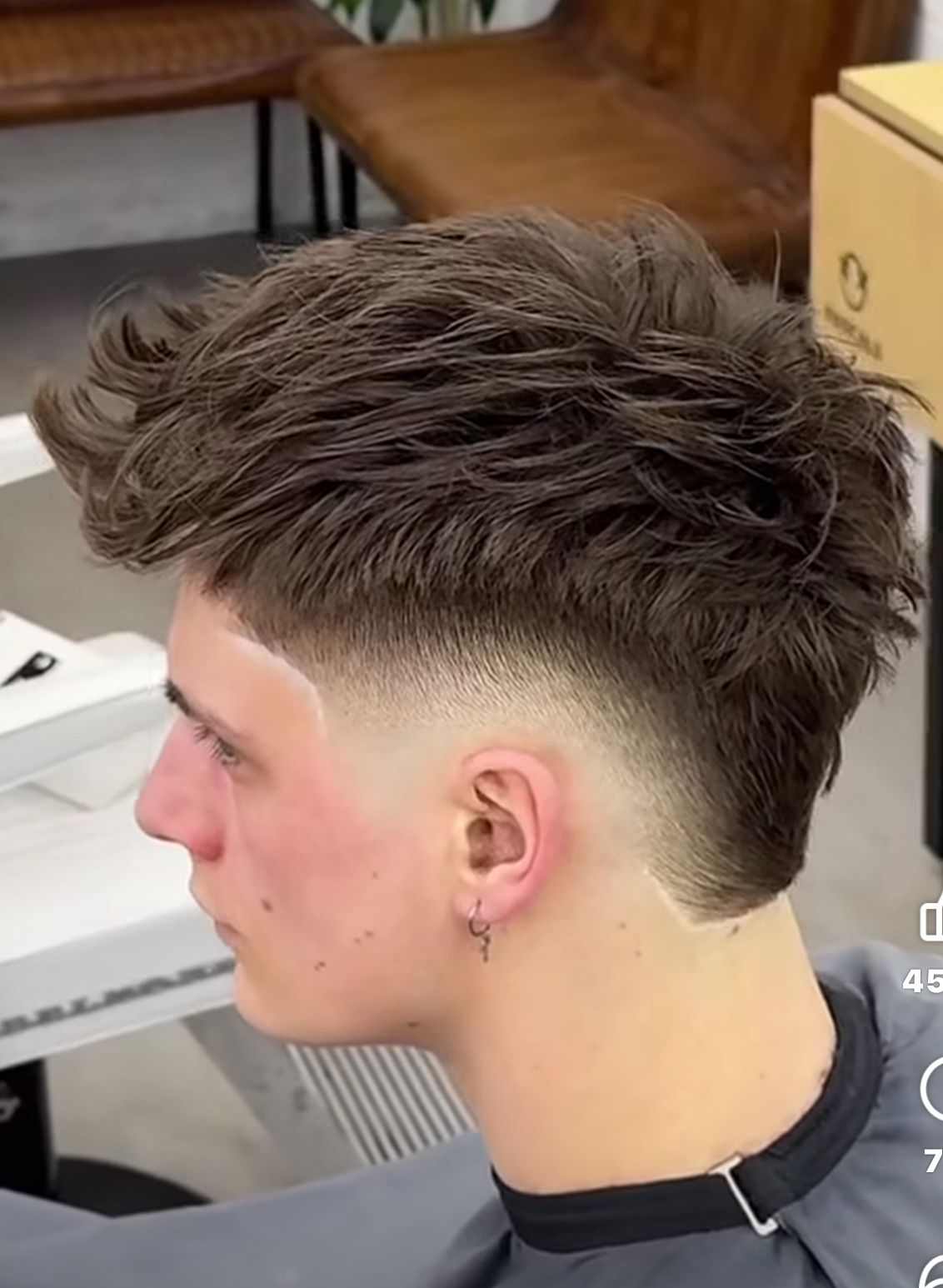 faux mullet haircut on a man with wavy hair, styled with matte pomade for a modern 2025 look